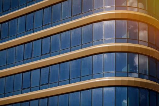 texture of blue glass high-rise corporate buildings and industrial skyscrapers in business office center