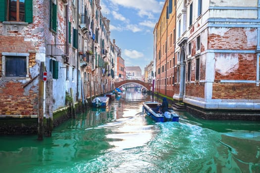 Turquoise channel in Venice architecture view, Tourist destination in Veneto, Italy