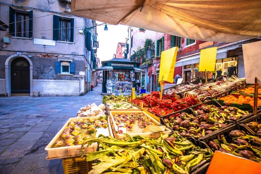 Fruit and vegetable stand in street of Venice view, northern Italy