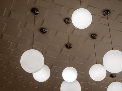 Round lamp, hanging alternating high and low, decorating the ceiling