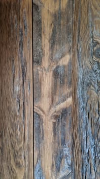Close-up of textured wooden surface with visible grain, warm tones and weathered charm, ideal for rustic design themes