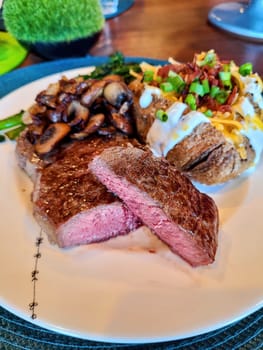 Sumptuous Home-Cooked Steak Meal in Fort Wayne, Indiana 2022 - Medium Rare Steak with Baked Potato and Sauteed Mushrooms Serving for Birthday Celebration