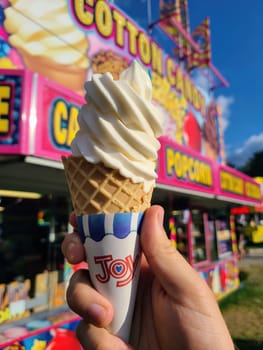 Joyful Summer Treat - Close-up of a Vanilla Soft-Serve Ice Cream Cone at a Vibrant Amusement Park in Fort Wayne, Indiana, 2023