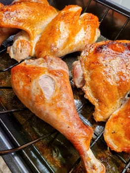 Golden roasted chicken pieces on wire rack, showcasing home cooking skills for Christmas meal, Fort Wayne, Indiana, 2021