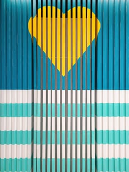 2023 abstract geometric design featuring a vibrant yellow heart centered on turquoise and blue stripes, symbolizing love within a structured environment, photographed in San Francisco, California.