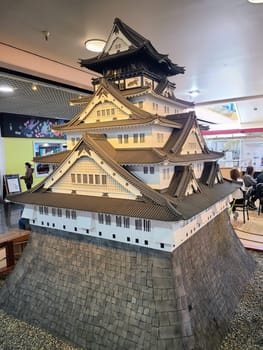 Elaborate model of a Japanese castle displayed indoors in a public space in San Francisco, California, showcasing traditional architecture and cultural heritage