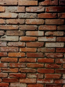 Close-up of traditional brick wall with rustic charm in Bloomington, Indiana, 2022, showcasing variation in texture and color at a Korean Fried Chicken restaurant.