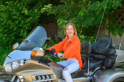 portrait of a young beautiful girl on a motorcycle 4