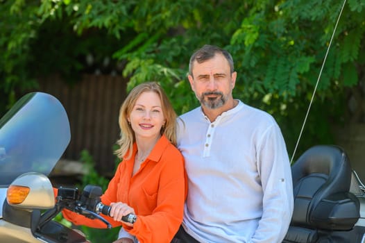 happy husband and wife sitting on a motorcycle 4