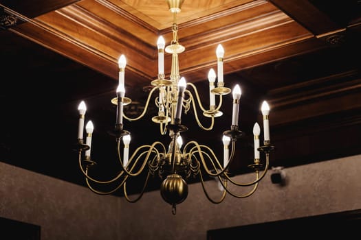 Chandelier on the ceiling .Chandelier in the european style. Vintage chandelier. Retro ceiling lamp 