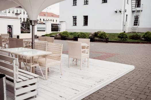 cozy outdoor cafe (bistro) with wicker furniture