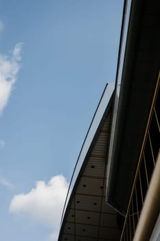 modern forms of city buildings against the blue sky.