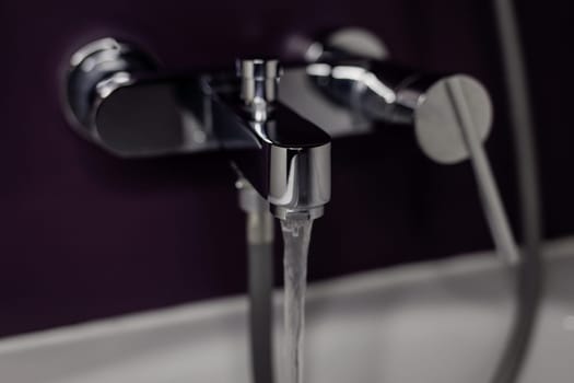 Interior of bathroom with sink basin silver faucet. Open chrome faucet washbasin. 