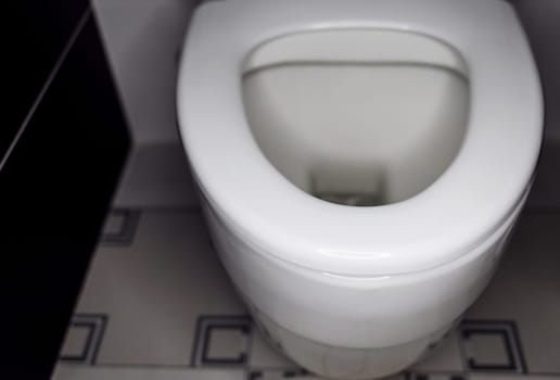 White toilet bowl in bathroom