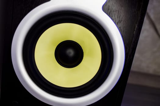 Yellow speaker. Music studio speaker