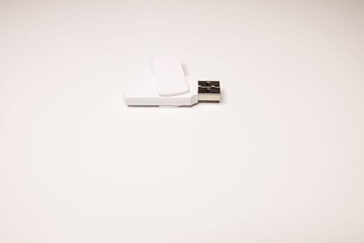 White USB flash drive close up on table
