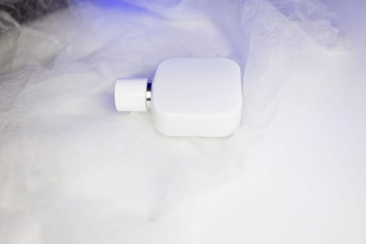 white bottle of perfume. a fragrance for men and women.