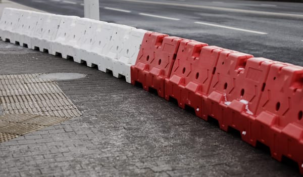 plastic road barriers. blocking the road in the city. danger