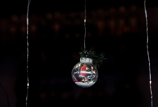 Clear Ball Ornament, small gift and christmas light inside.