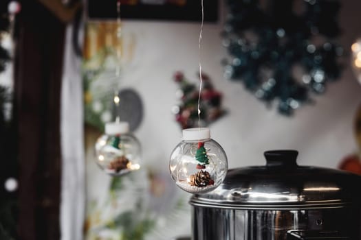 transparent Christmas ball with decor garland. DIY Christmas decorations. New Year's lighting.