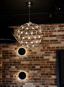 decorative stylish lamp in the loft interior
