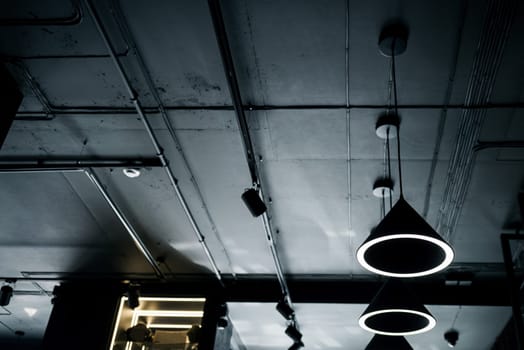 hanging lamps in the loft style . Cold light