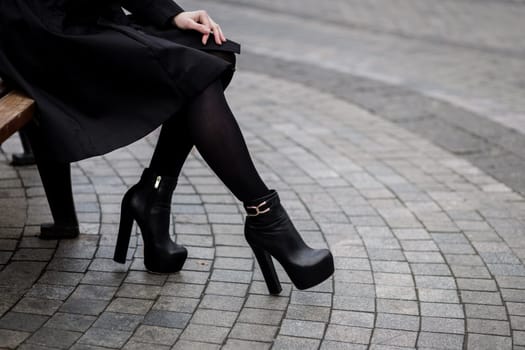 women's shoes with big heels. black boots. glamorous style