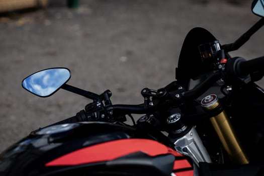 element of a sports motorcycle. mirror and front of the bike