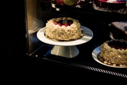 delicious cream cake with almond chips on display