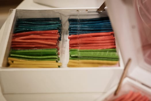colorful licorice yummy candies in box. delicious junk food