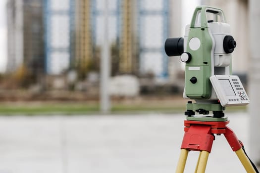 Optical level. A tool for carrying out geodetic work and measuring the difference in height between points on a plane. Copy space