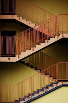 stairs for fire escape of the factory building.The factory wall building and the yellow stair building