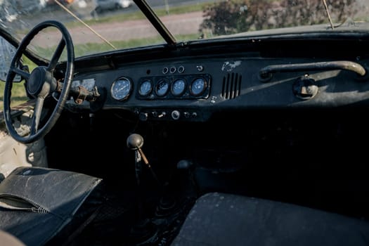 dashboard of a rusty abandoned retro car