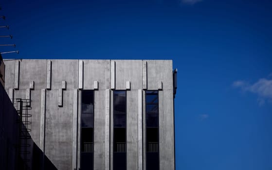 minimalistic architecture. concrete building over sky background