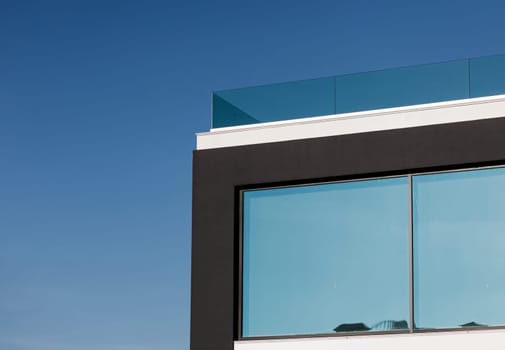 element in front of a modern house over sky background. commercial real estate