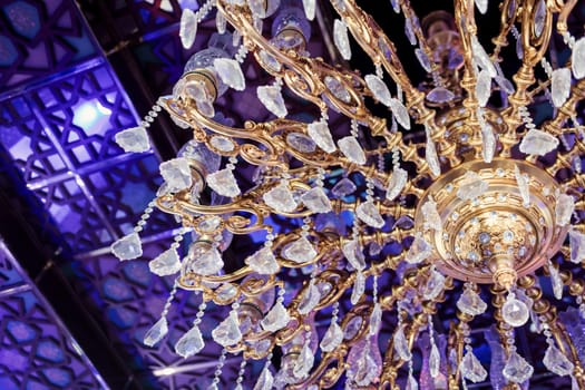 antique beautiful crystal chandelier in room