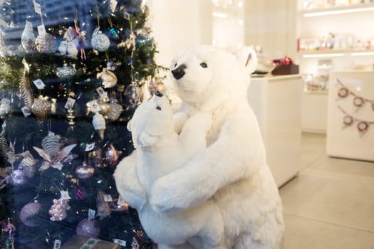 White polar bear near christmas tree