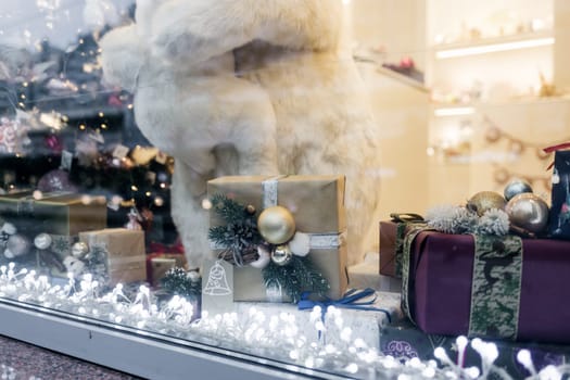 decorated shop window for Christmas. holiday decor and gift boxes