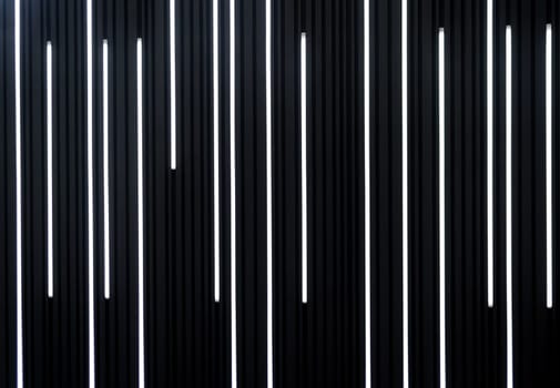 futuristic wall with striped lamps. vertical lights