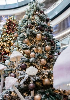 perfect christmas tree with lighting garlands in mall.  