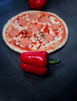 red pepper on the background of classic Italian pizza