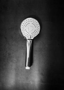 shower head with the turn lever of a spray settings on a dark background