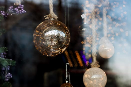 Vintage balls on christmas tree. Bokeh garlands in the background. New Year concept.