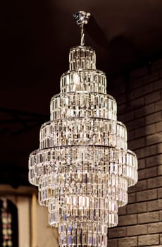 Big modern chandelier. Luxury crystal lamp