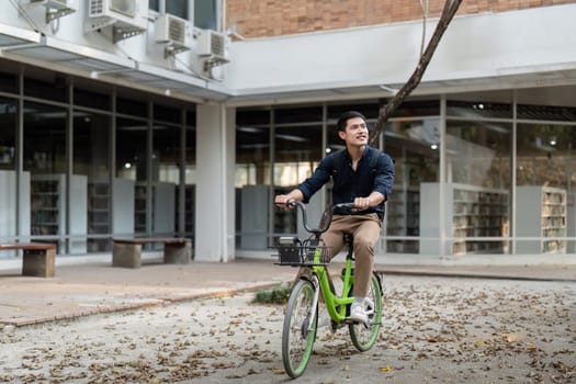 Businessman and bicycle in city to work with eco friendly transport. happy businessman professional riding a bicycle in urban street.