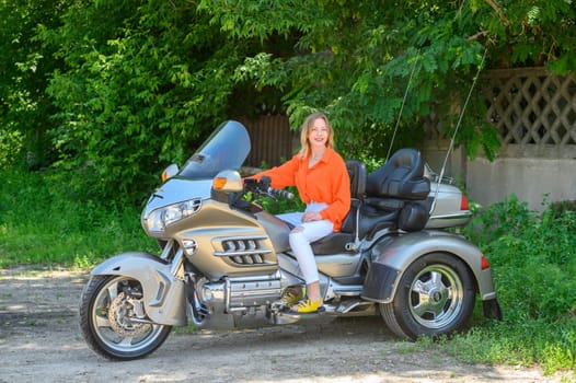 portrait of a young beautiful girl on a motorcycle 2