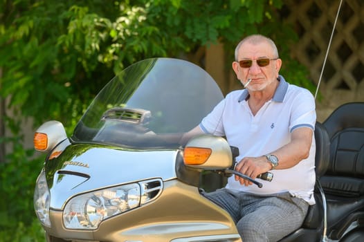 elderly man sitting on a motorcycle 6