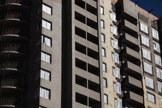 gray unfinished concrete building. housing loan