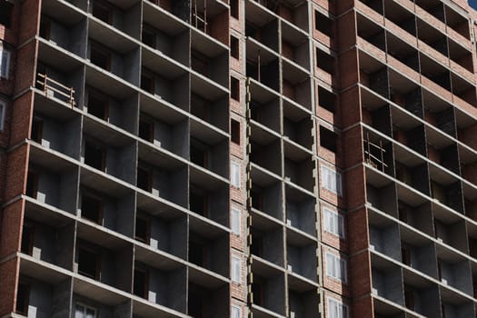 Unfinished cement building on a construction site.