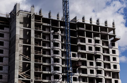 Building under construction, construction site with crane. mortgage